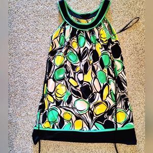 Adorable bright summer dress. Wear alone or with leggings. Too cute!